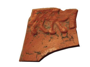 Fragment de vaixella fina (sigillata africana D) amb decoració figurada en estampilla